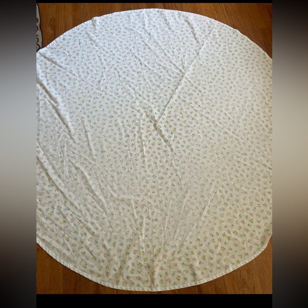 Floral round fabric tablecloth approx 68 inches round.